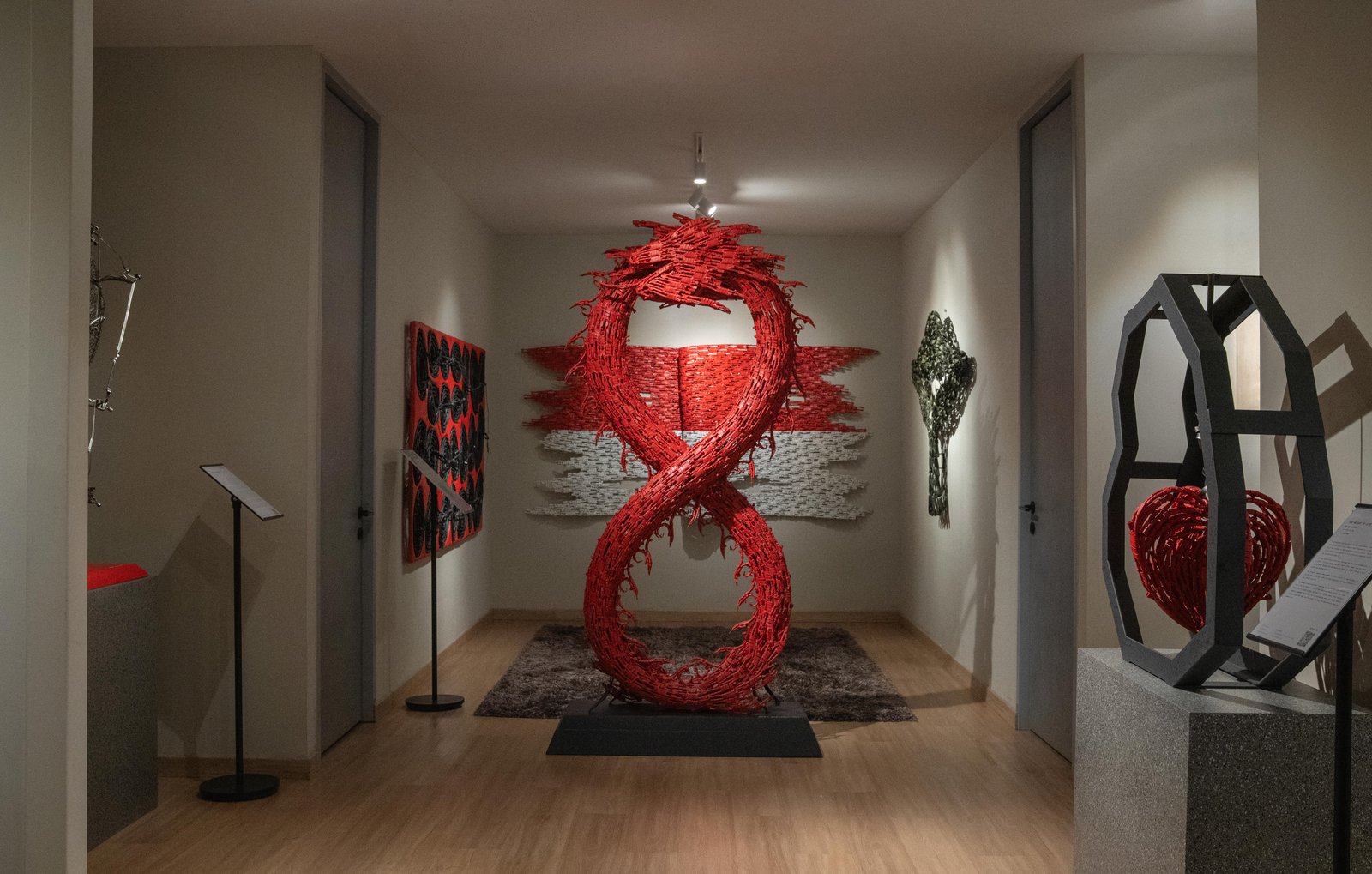 Merah Gallery interior with red flag sculpture installation